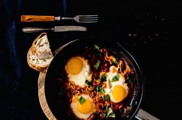 skillet with eggs cooking